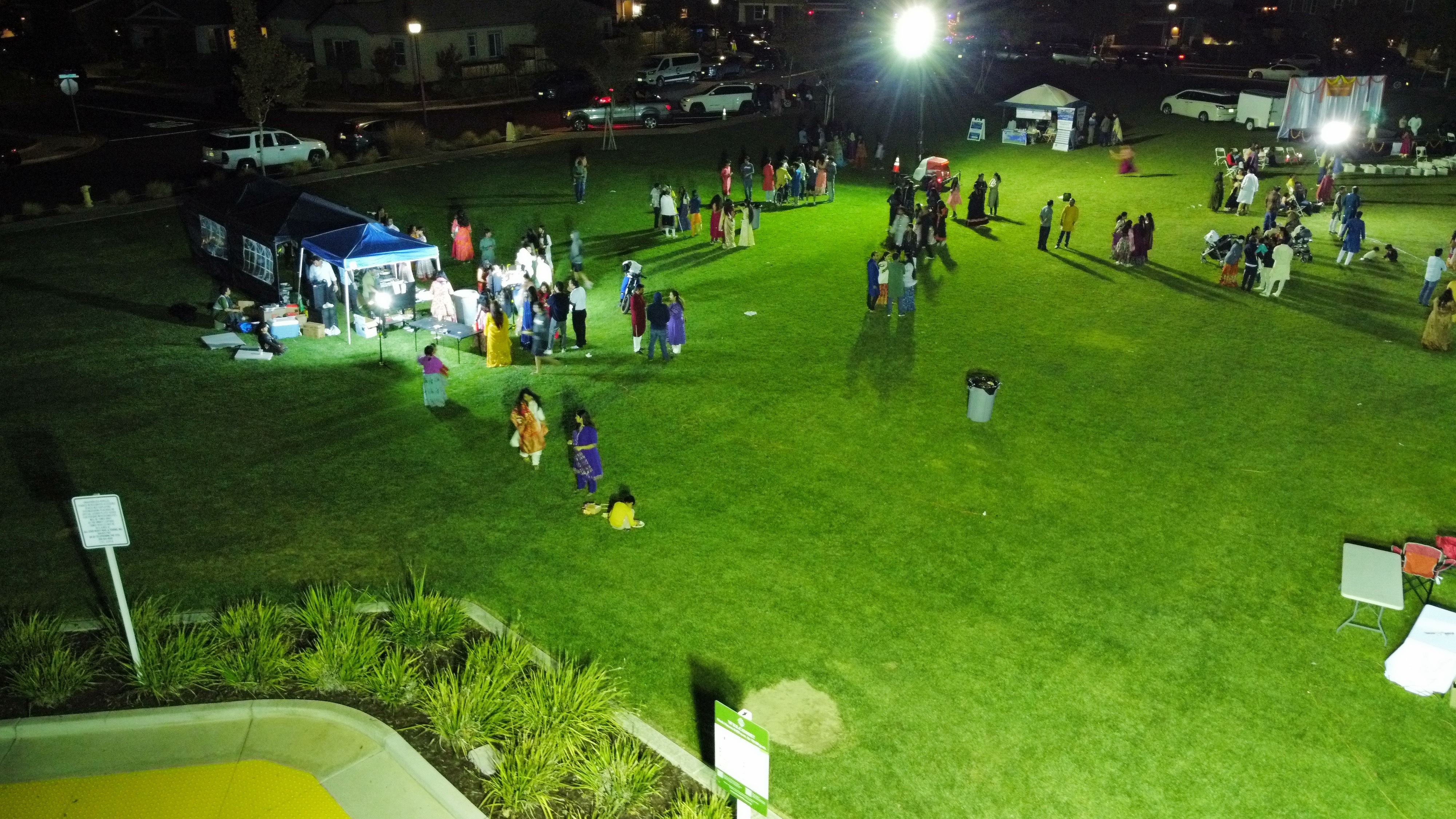 Light tower illuminating construction area aerial view